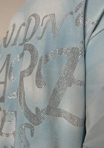 Close-up view of fabric rhinestone for Washed Double-Layer Graphic T-Shirt