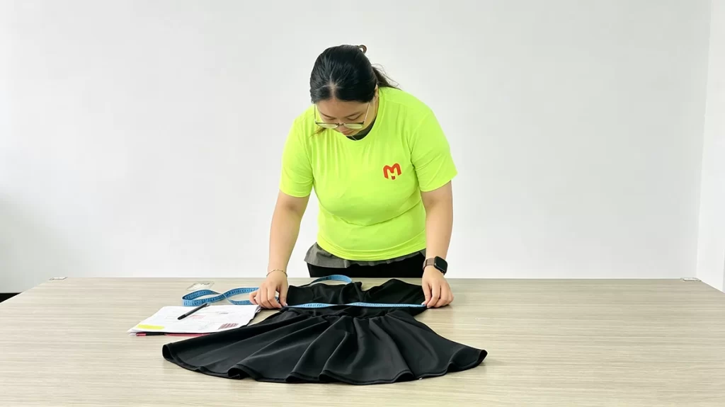 measuring sample size Clothing sample review and measurement check before bulk production